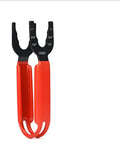 Orange handled 12-inch adjustable cast iron pipe wrench on a workbench.