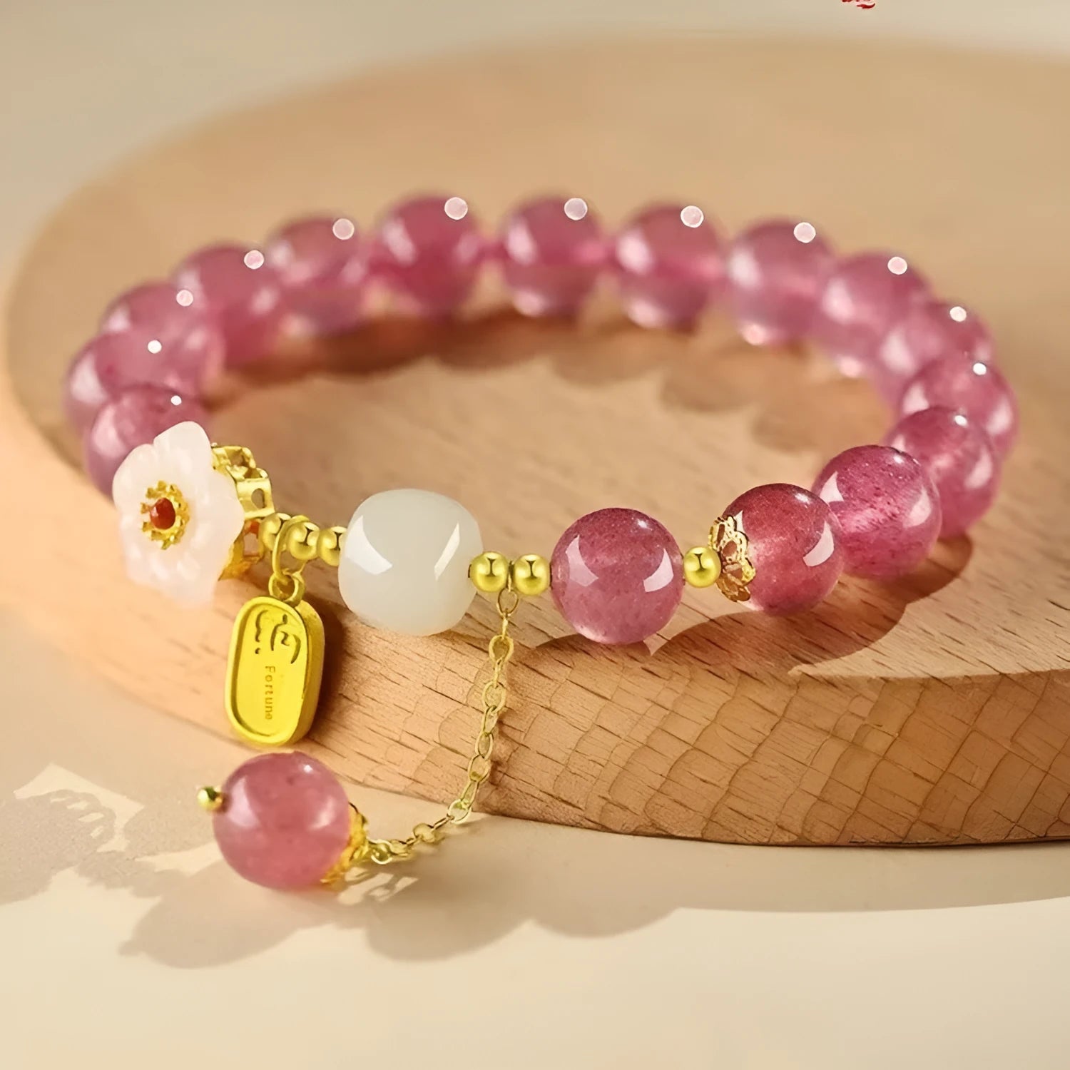 Handmade natural crystal bracelet with strawberry quartz decorative elements in pearl, moon, XINGX, or green design options