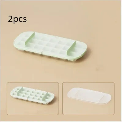 Blue high-capacity ice cube tray with integrated storage for an ice shovel.