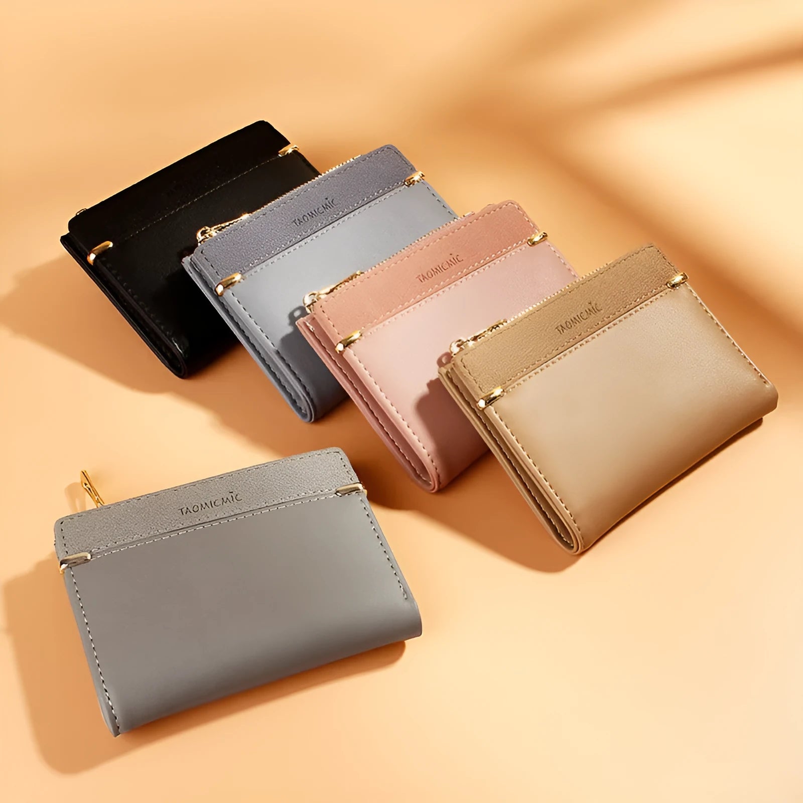 A two-fold PU leather ladies wallet with a zipper, shown in multiple colours, displaying internal card slots and compartments.