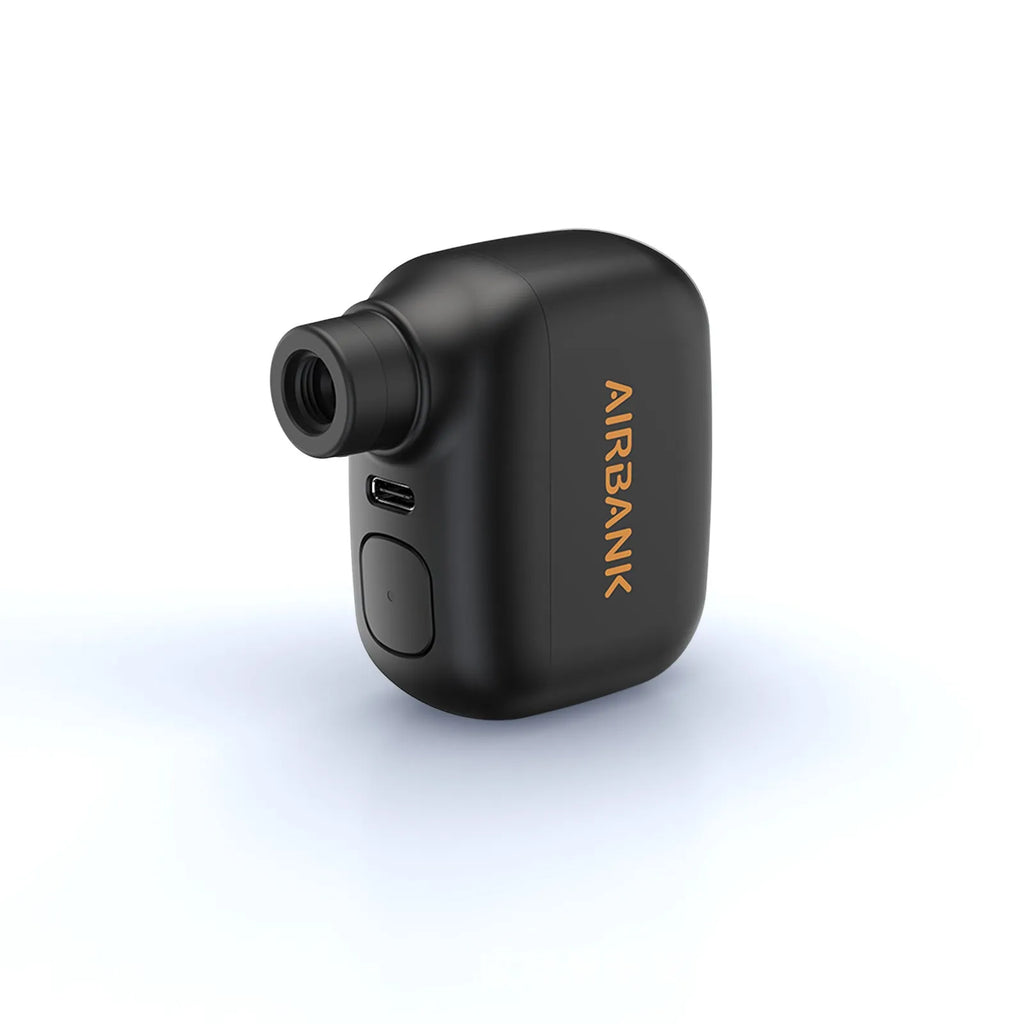 Black AS100 electric bike pump with USB cable and waterproof bag on a white background.