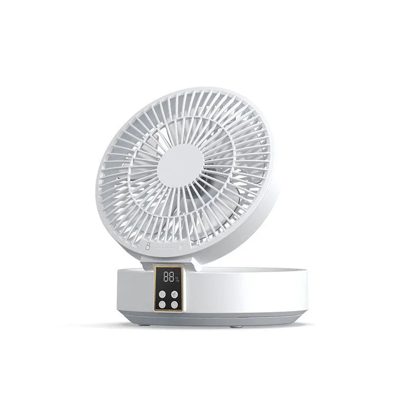 White portable USB rechargeable folding desk fan with remote control on wooden surface