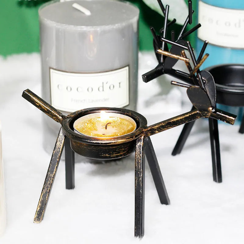 Black iron Christmas candlestick holder with creative elk bracket design for table decoration.