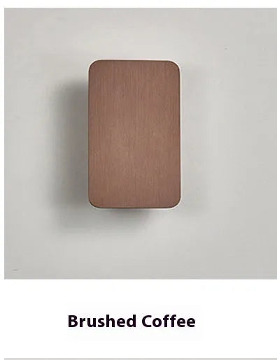 Minimalist modern LED wall lamp in black finish mounted on a wall