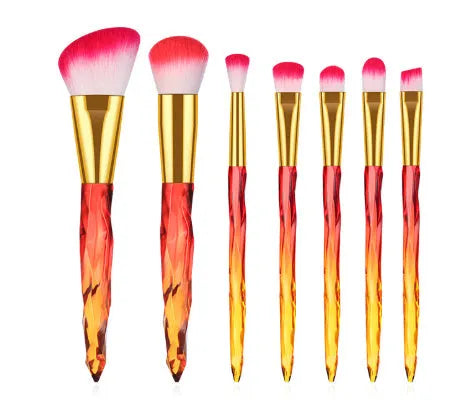 Ten clear crystal diamond shank foundation brushes with artificial fibre heads, shown in a set.