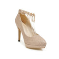 Women's blue platform high heels with stiletto heel and pointed toe on a plain background.