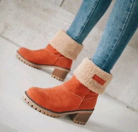 Women's thick suede mid-calf snow boots with a round toe, flat low heel, and waterproof platform sole.