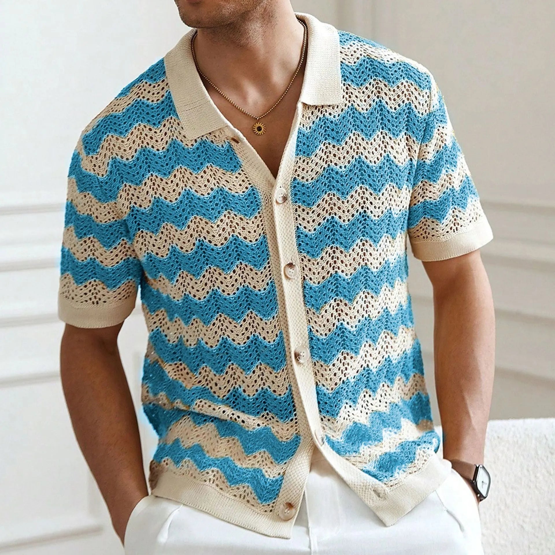 Short sleeve blue hollow jacquard corrugated sweater with flocking detail on a hanger.