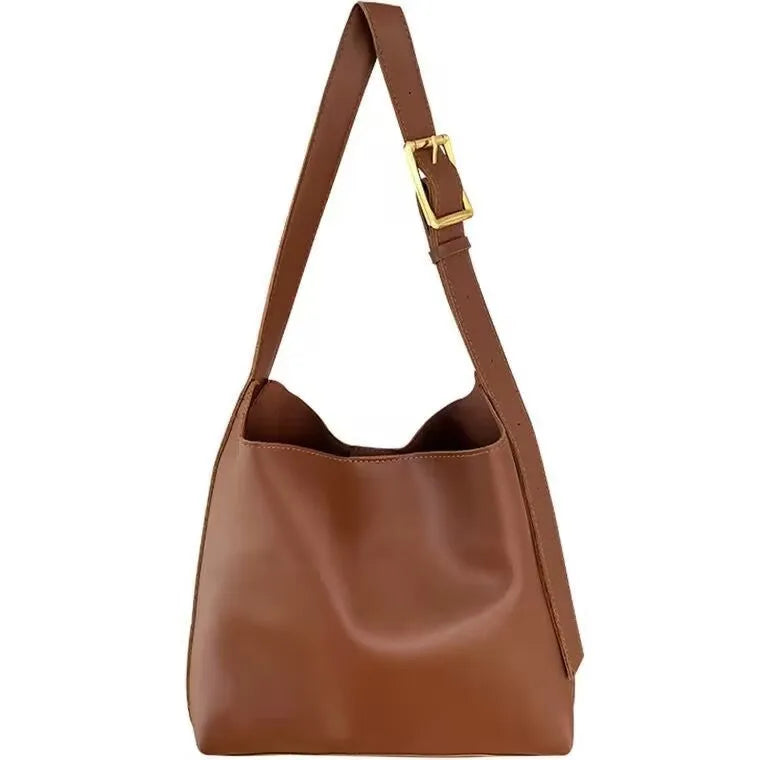 Women's soft PU shoulder bag with swing thread detailing in black ribbon or brown colour options