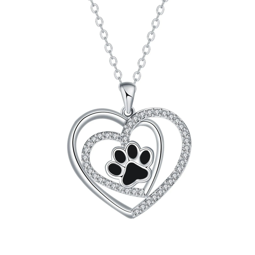 Women's copper necklace with heart-shaped dog paw print pendant on a cross chain