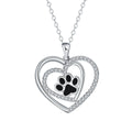 Women's copper necklace with heart-shaped dog paw print pendant on a cross chain