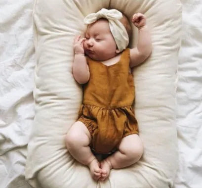 Beige portable cotton baby nest crib for newborn, measuring 75cm by 45cm.