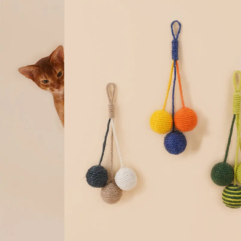 Set of three cat toys: a teaser stick, a catnip ball, and a self-play wand on a blue background.
