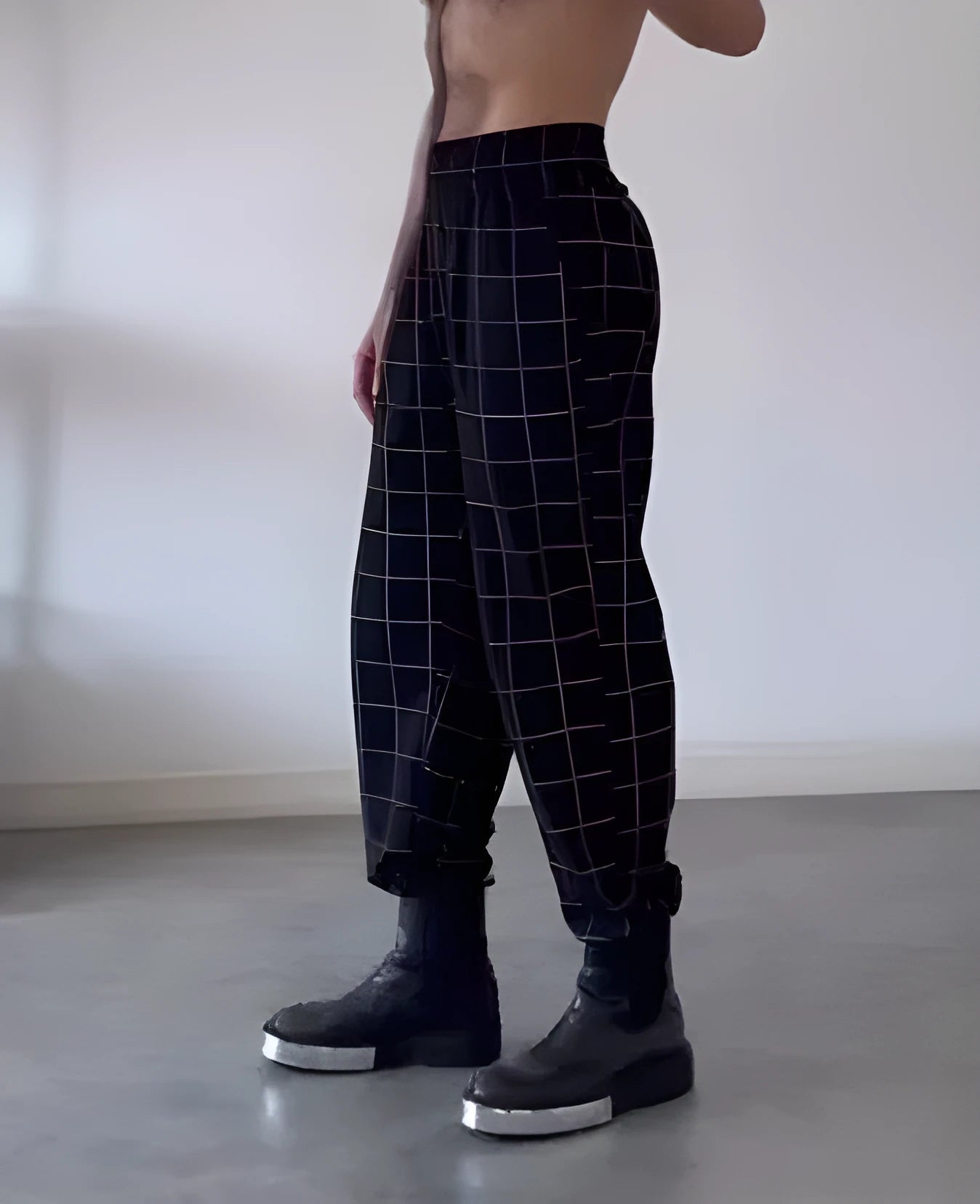 Men's plaid trousers with apron-style design in multiple sizes featuring adjustable waistband and front pockets