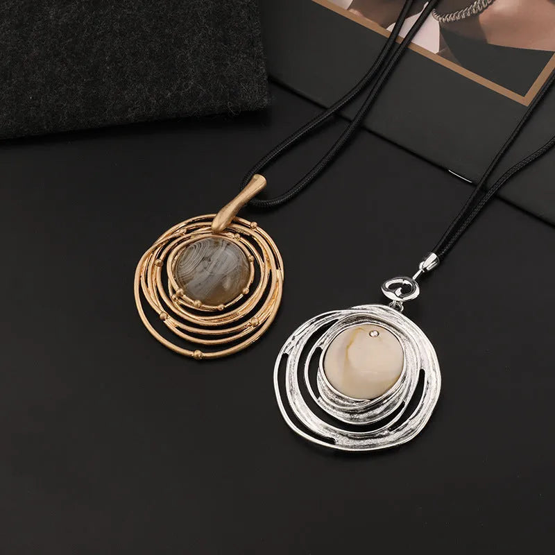 Gold tone geometric pendant necklace with snake chain for women, adjustable up to 80cm.