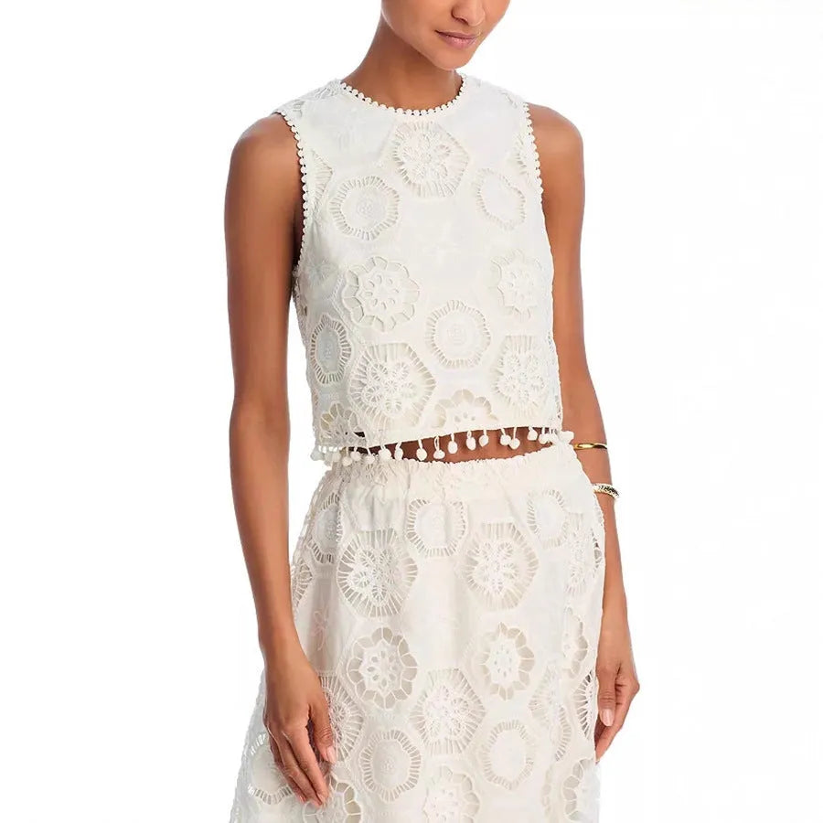 White women's retro style embroidered two-piece suit with sleeveless top and long skirt