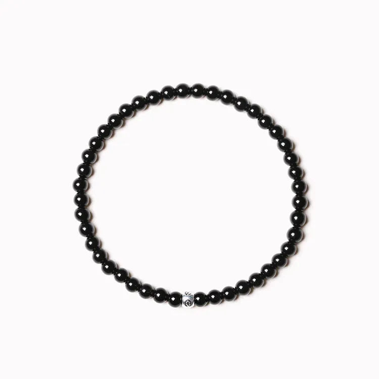 Fine geometric agate bracelet with round and square 4mm beads in obsidian, blue san, and black agate colours.