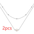 S925 sterling silver double layer necklace with twin pearls on a geometric pendant, shown in gold and white gold finishes.