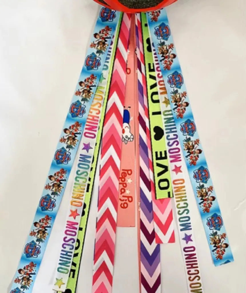 Children's decorative helmet streamer ribbon in multiple colours for roller skating and skiing safety gear.