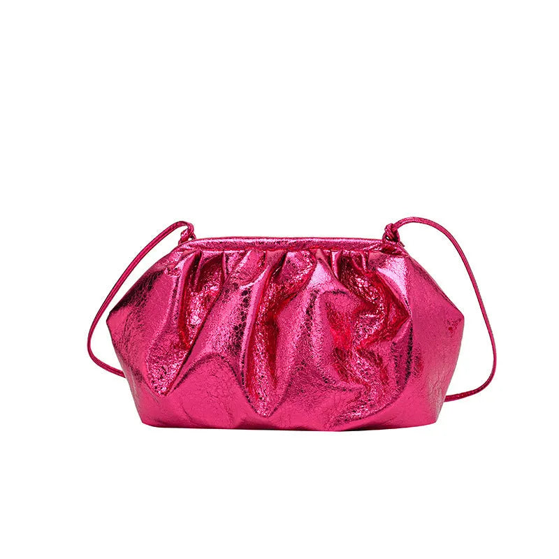 Shell-shaped crossbody bag with hair clip shoulder strap showing multiple compartments including mobile phone pocket