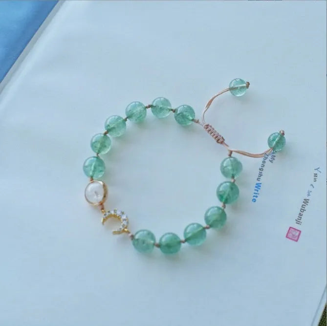 Handmade natural crystal bracelet with strawberry quartz decorative elements in pearl, moon, XINGX, or green design options