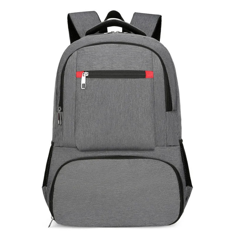 Light grey oxford cloth insulated backpack with curved shoulder straps and top handle.