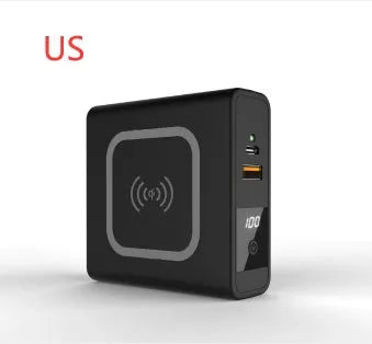 Black and white Super QI wireless charging power bank with integrated plug and international adaptors.