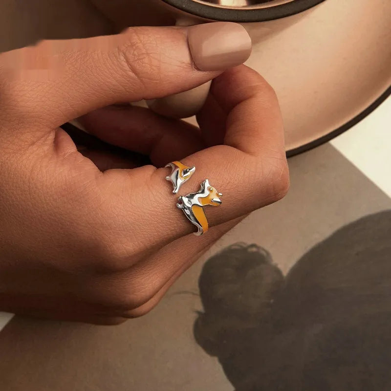Silver ring with a raised cartoon corgi dog design, electroplated finish.