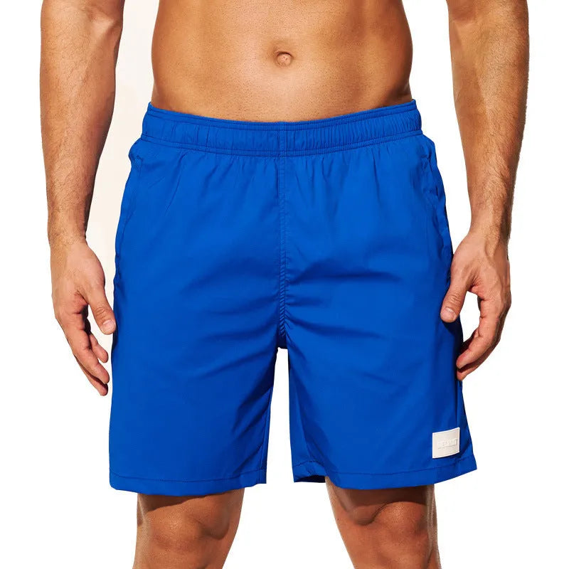Men's quick-drying nylon beach shorts in solid colours with straight leg opening