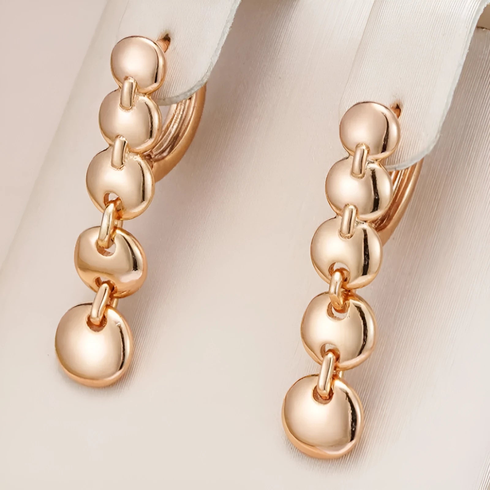 Gold-coloured woven copper round circle drop earrings with retro design.