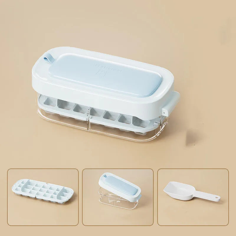Blue high-capacity ice cube tray with integrated storage for an ice shovel.