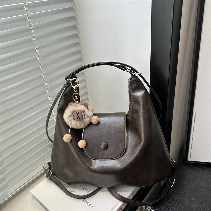 Women's black PU leather single shoulder bag with horizontal square shape and dedicated phone compartment
