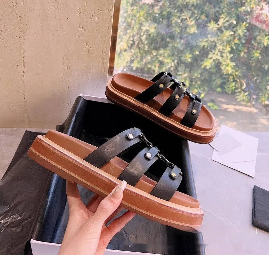 Women's brown retro Roman style sandal slippers with a sheepskin upper and patent leather finish.