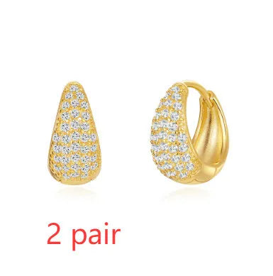 Geometric brass diamond earclip earrings with round accents in golden electroplated finish