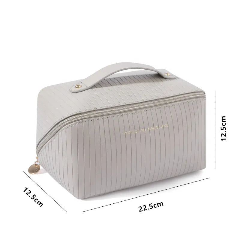 Cubic pillow makeup bag with vertical pattern in five colour options showing 22.5cm dimensions