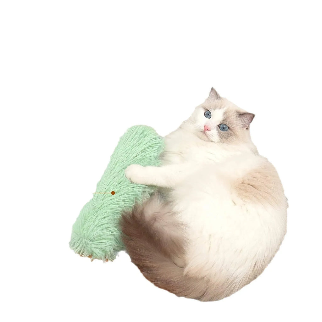 Soft plush cat toy pillow in blue, green, pink, or white, measuring 27cm long by 10cm wide