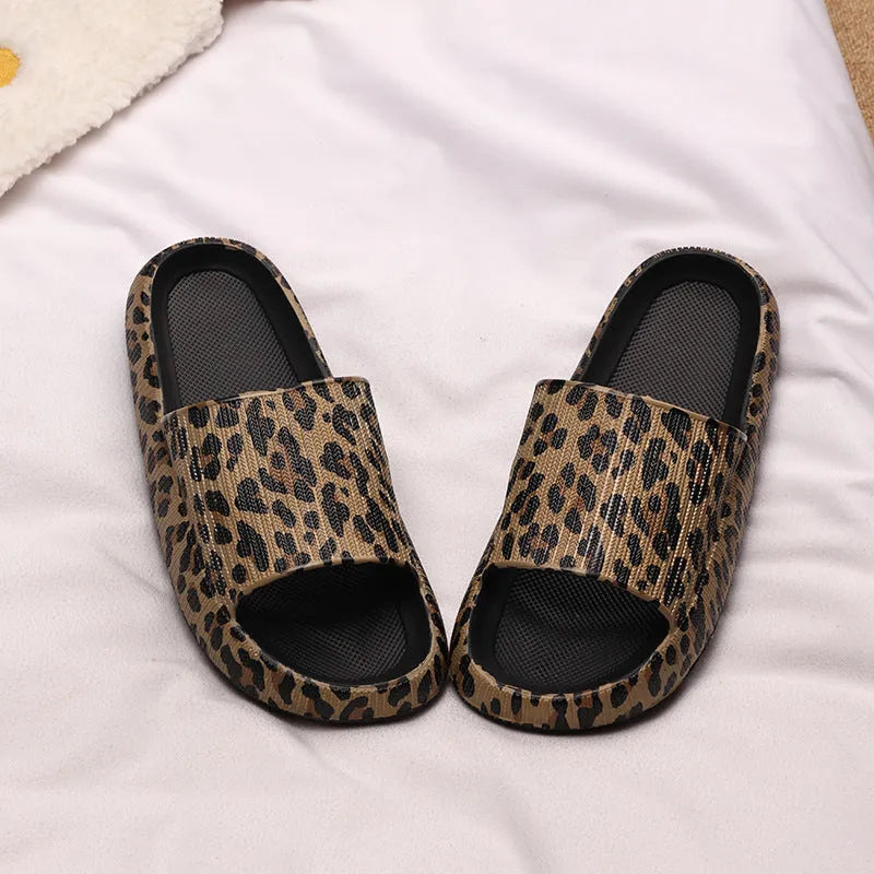 Women's leopard print slipper with thick EVA sole shown in multiple colour and print options.