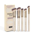 Five apricot-coloured makeup brushes with angled synthetic bristles for powder, blush and foundation application
