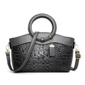 Fashion handbag in fabric with shoulder strap, showing internal phone and card compartments