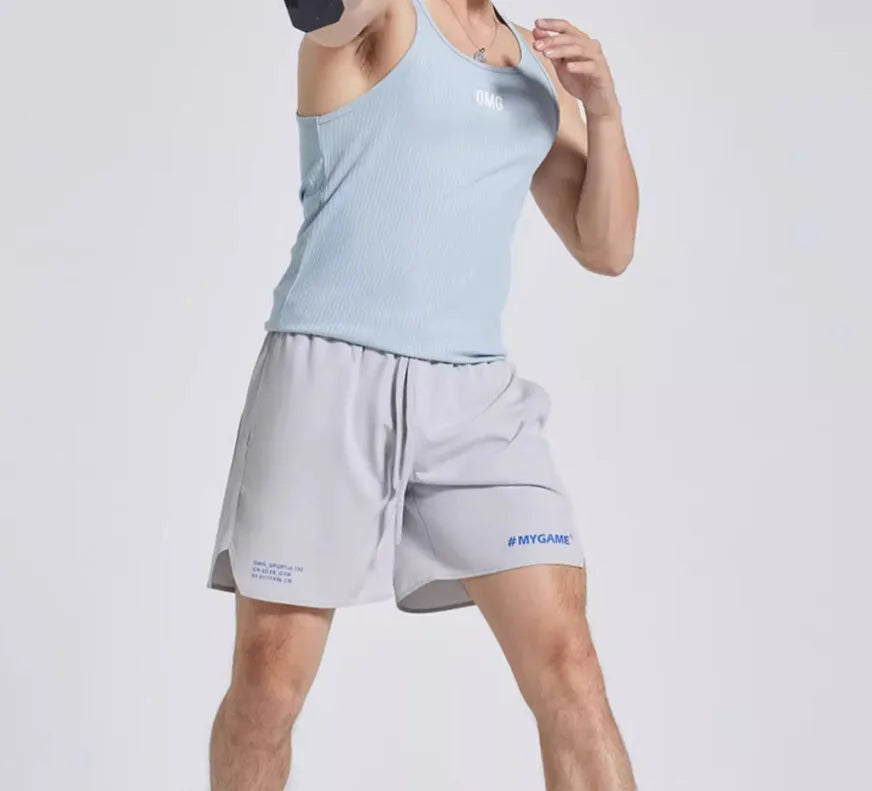 Men's training shorts in black, blue, grey, and white colours from a front view.