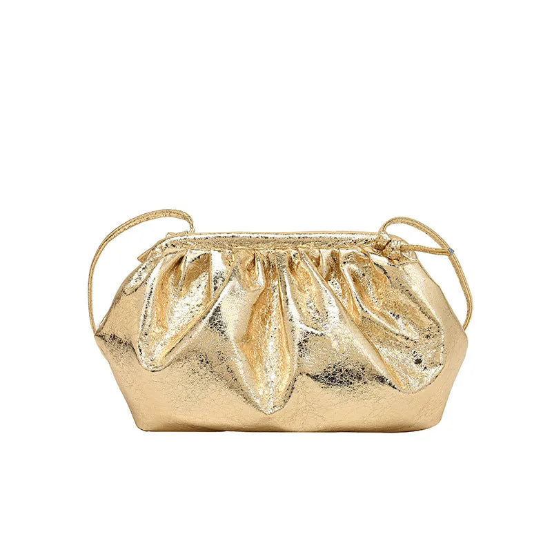 Shell-shaped crossbody bag with hair clip shoulder strap showing multiple compartments including mobile phone pocket