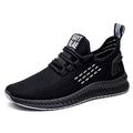 Men's low-top casual sports shoes with Flying Weave upper, cross straps on striped pattern, and flat sole.