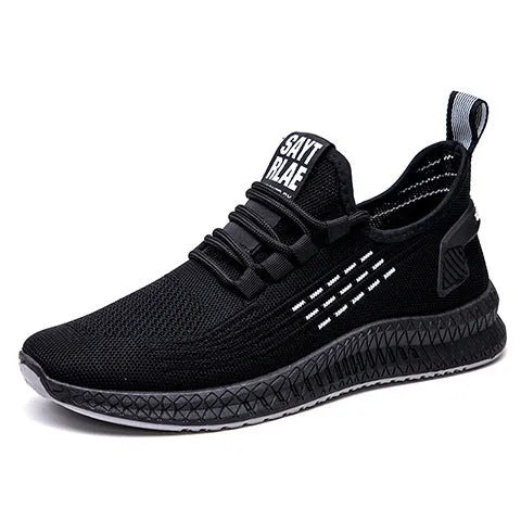 Men's low-top casual sports shoes with Flying Weave upper, cross straps on striped pattern, and flat sole.