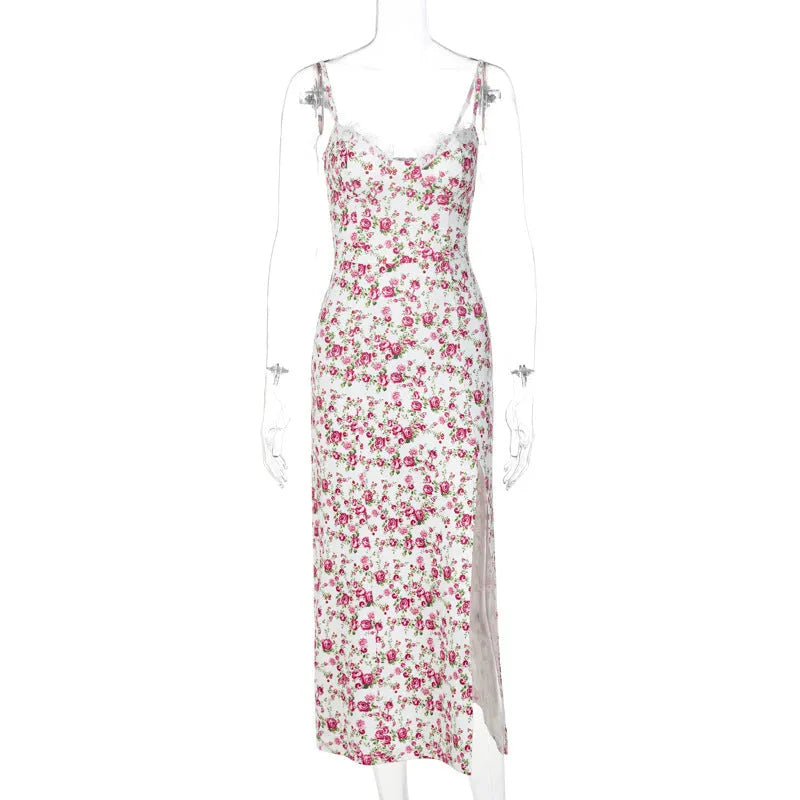 Women's blue lace flower print long dress with suspender neckline and side slit.