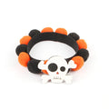 Halloween pet collar with a fur ball decoration in a pumpkin design, shown in size M