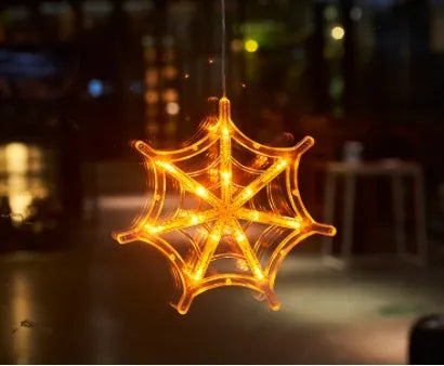 Halloween window hanging LED lights with seven designs including spider, pumpkin, ghost, and bat motifs