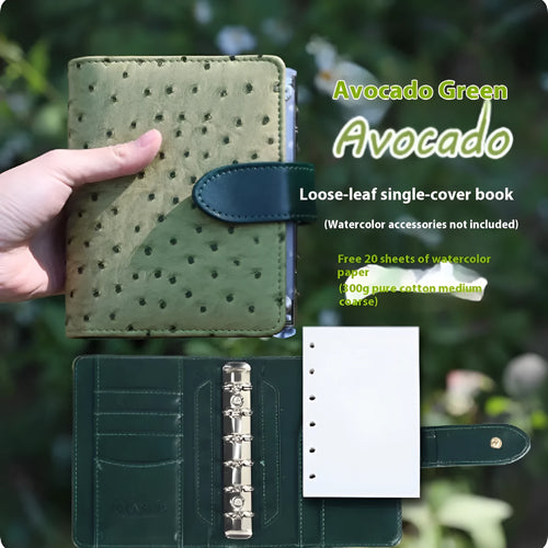 A7 format loose-leaf watercolour book in avocado green, open to show painting pages