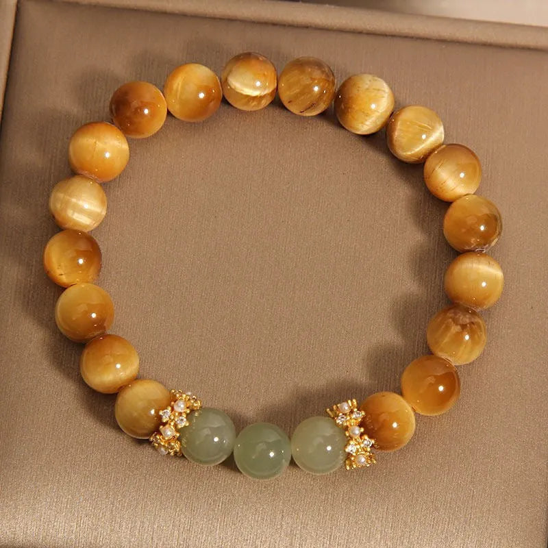 Natural yellow tiger's eye and Hetian jade bracelet with U-shaped bead design showing golden gourd pattern