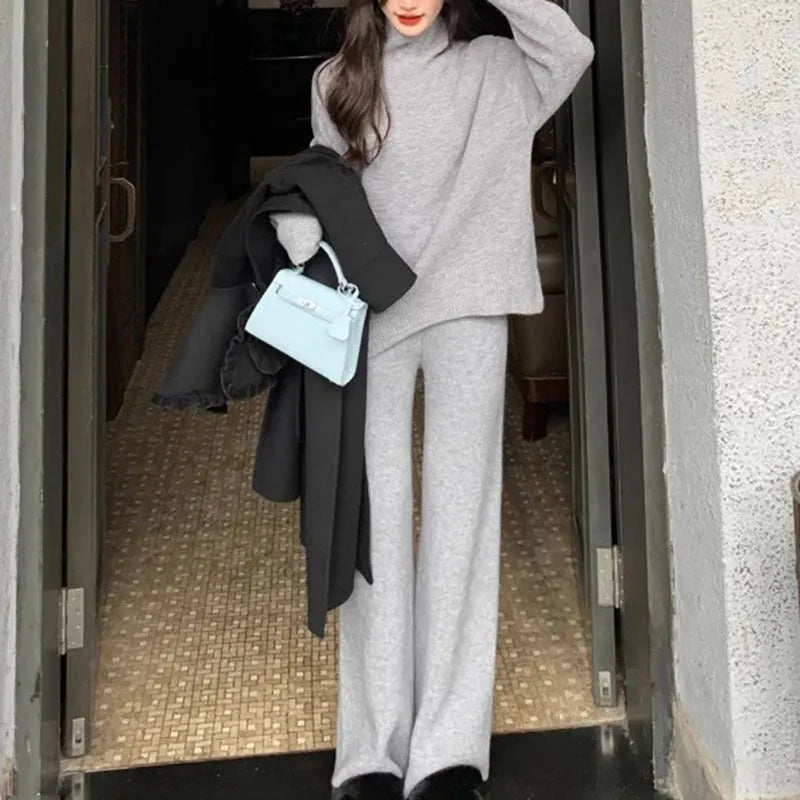 Women's casual acrylic fibre two-piece set with long-sleeve sweater and wide-leg trousers in solid colour.