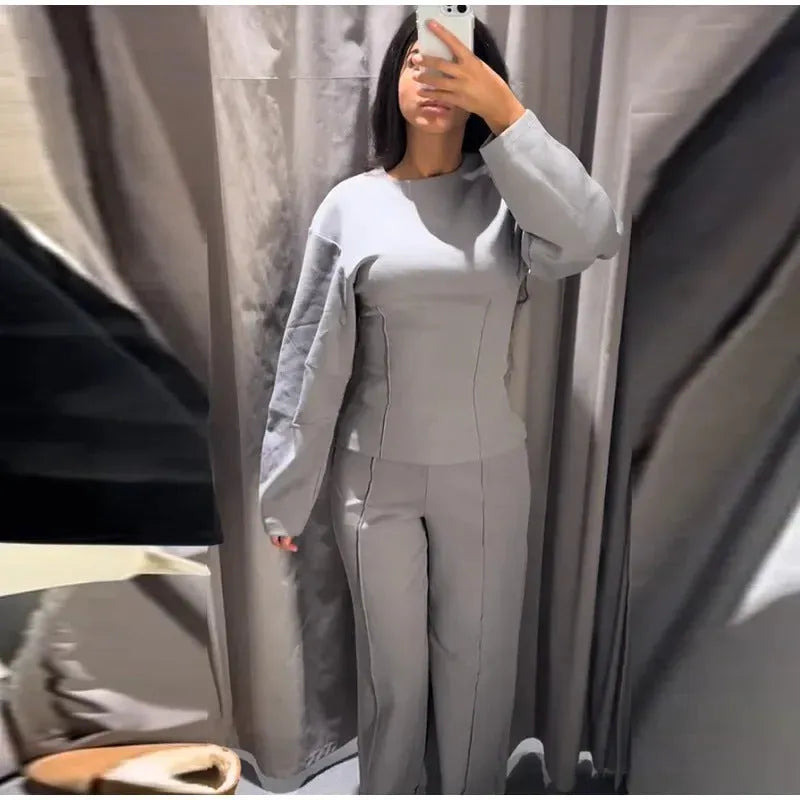 Women's black polar fleece suit set with O-neck top and wide leg trousers